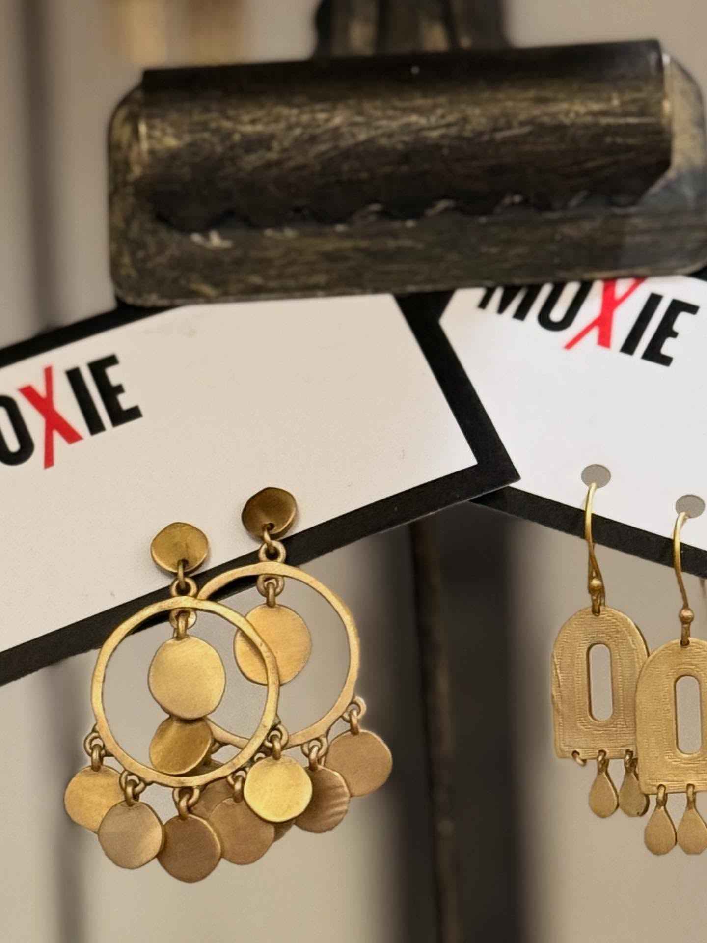 Layered gold jewelry and accessories from Moxie Boutique Bainbridge GA