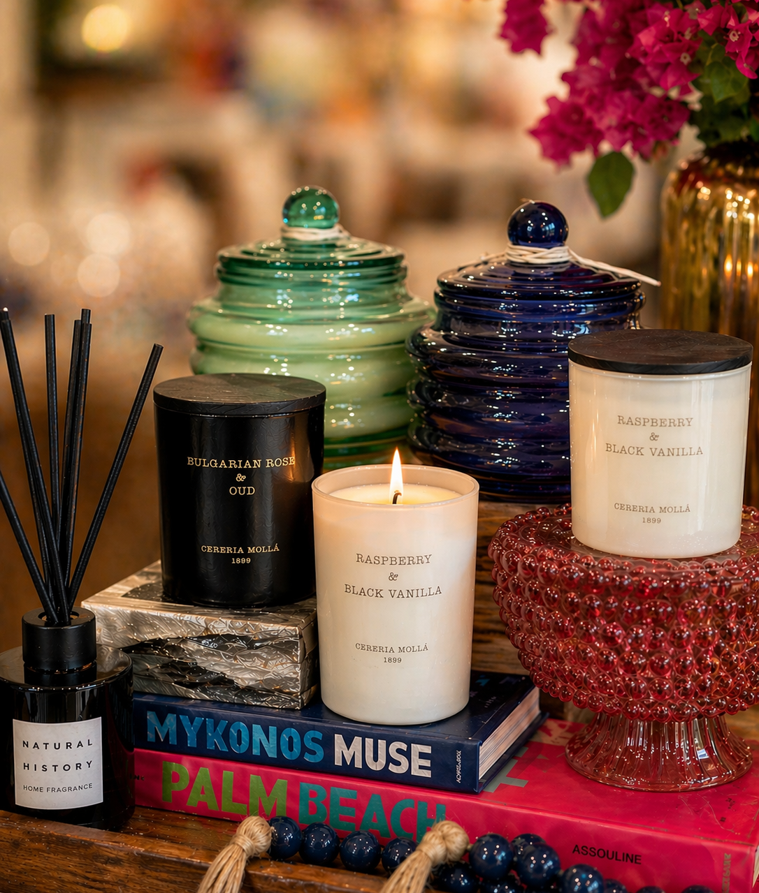 Candles and decorative items on a table with a blurred background