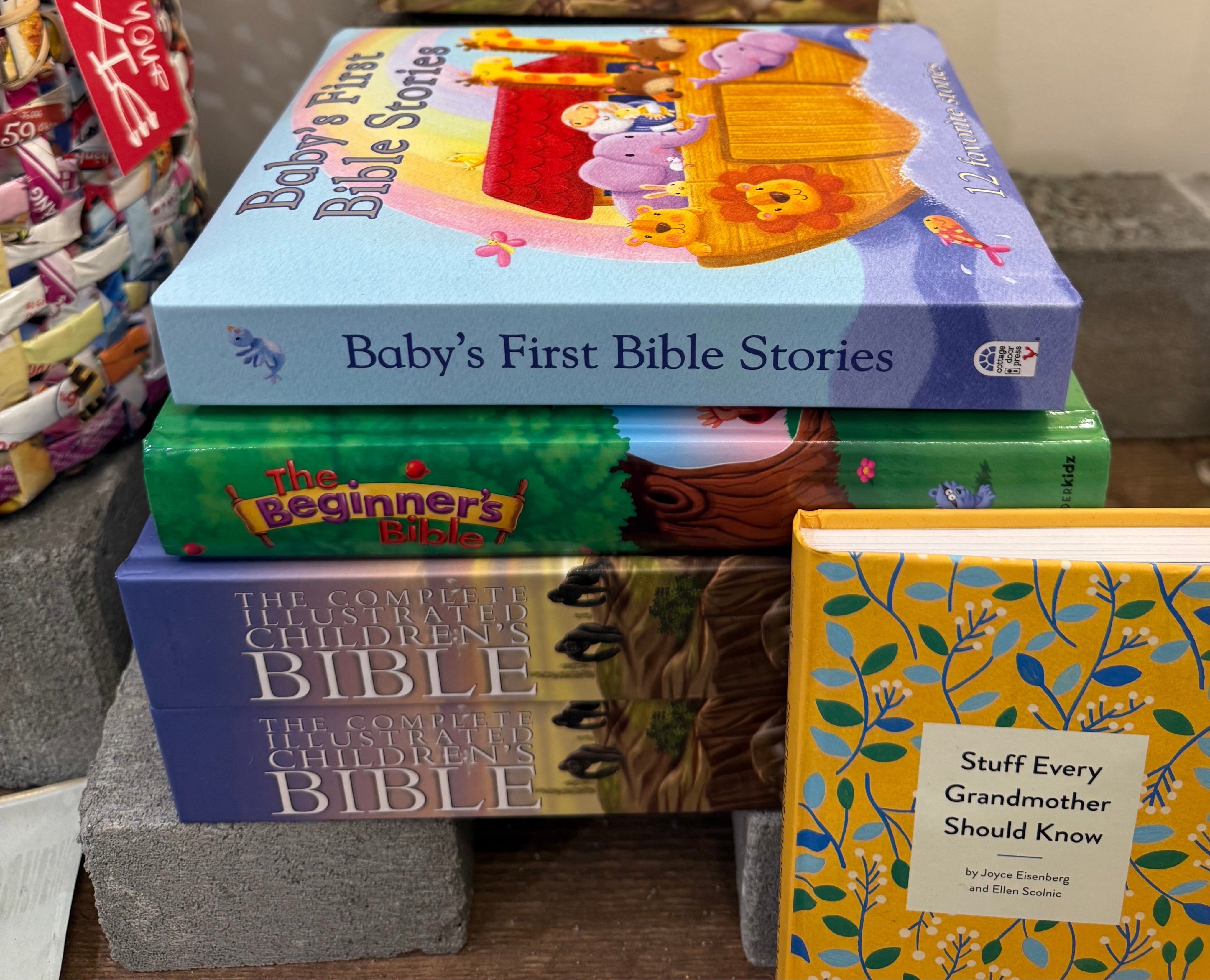 Stack of children's books on a shelf with various covers