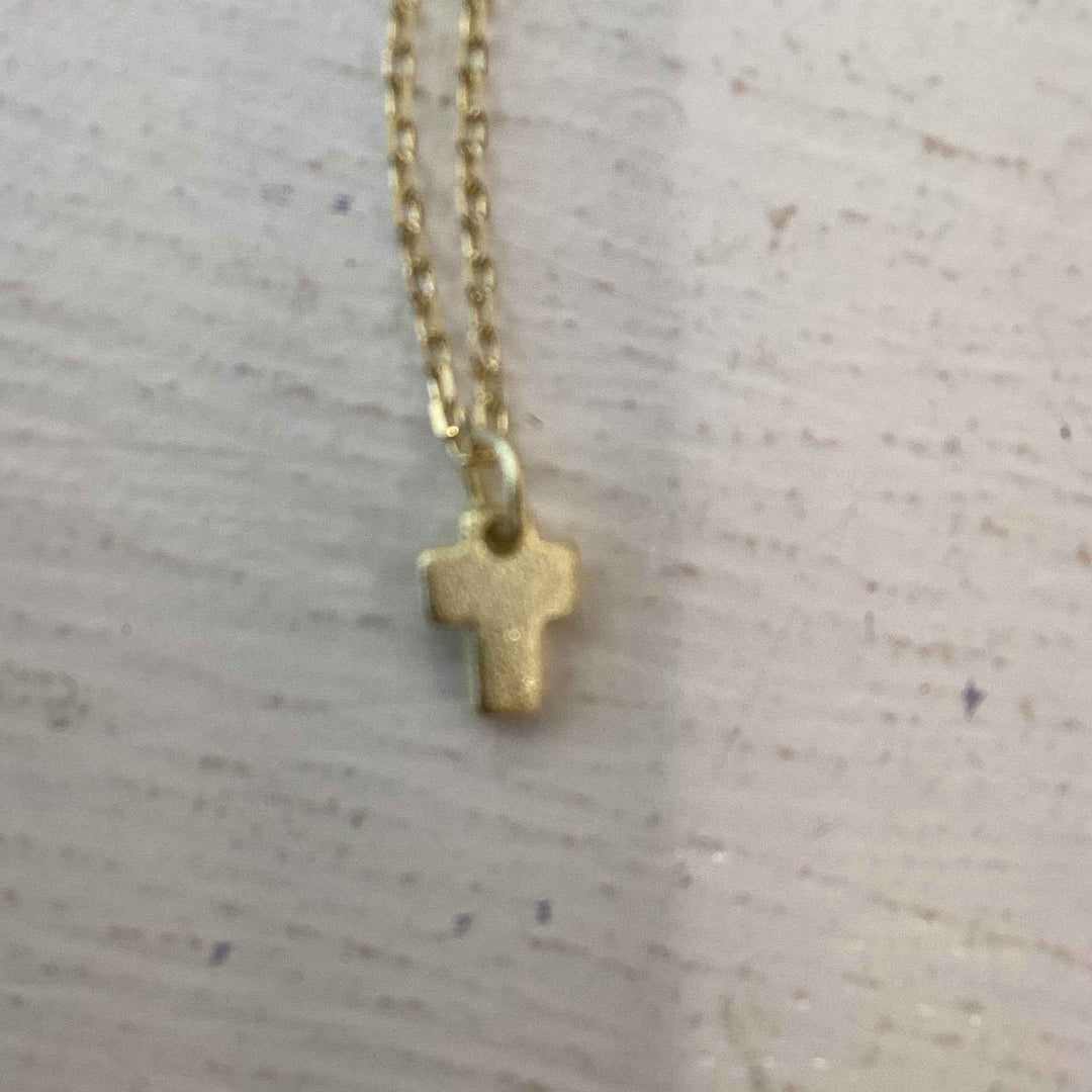 Gold open paved cross necklace