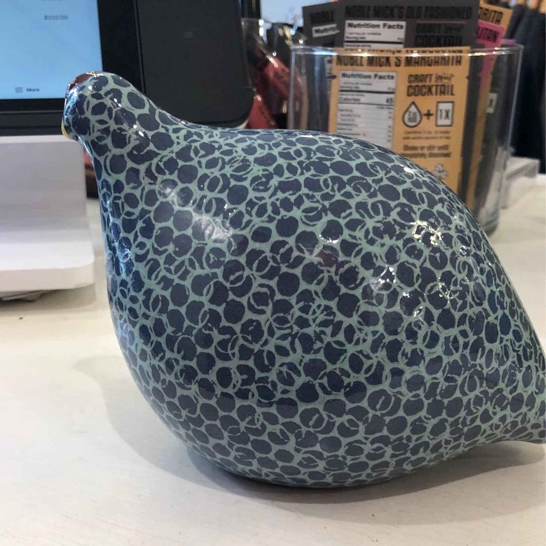 Small spotted blue and turquoise quail